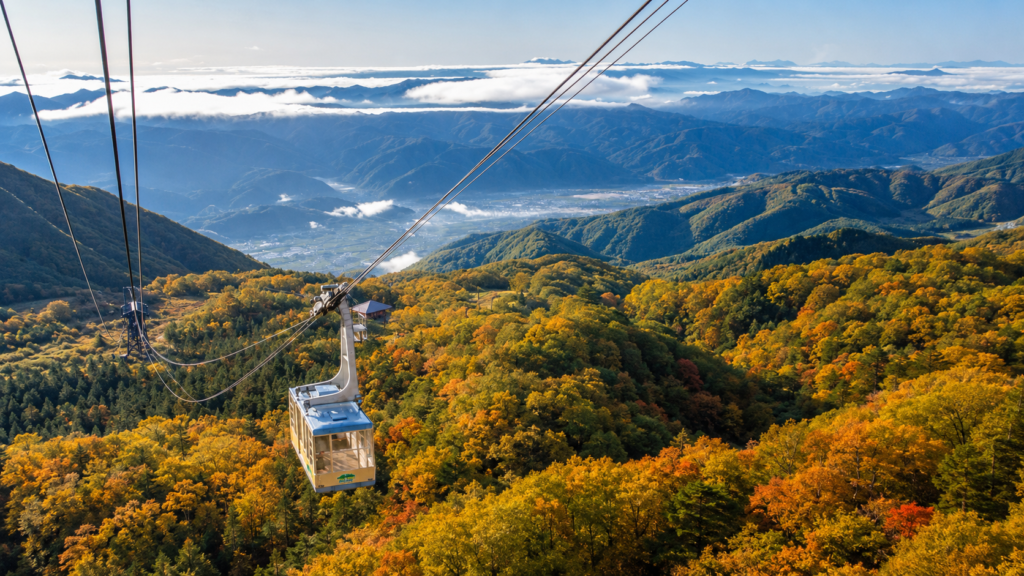 黒岳の紅葉の上を進むロープウェイ